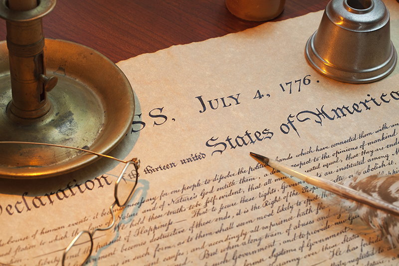 Declaration of Independence with candle holder, glasses and quil